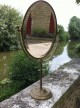 Ancien miroir de magasin Siegel en bronze