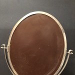 Ancien miroir de magasin de chapelier.